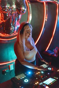 Live DJ performance during night event at Aura Grill and Bar
